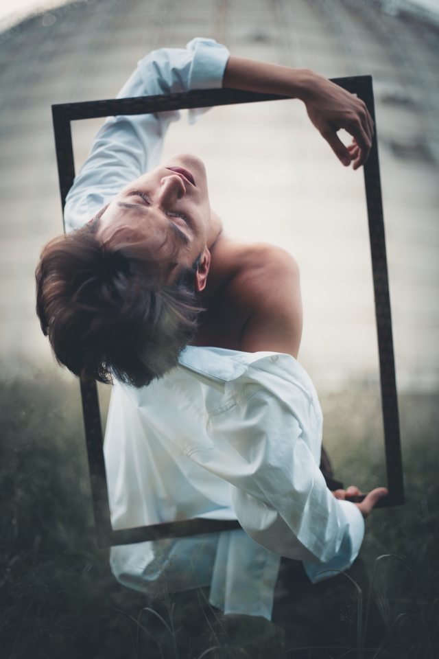 man-wearing-white-long-sleeved-dress-shirt-holding-2035871