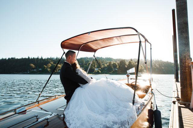 bride-and-groom-riding-powerboat-1439264